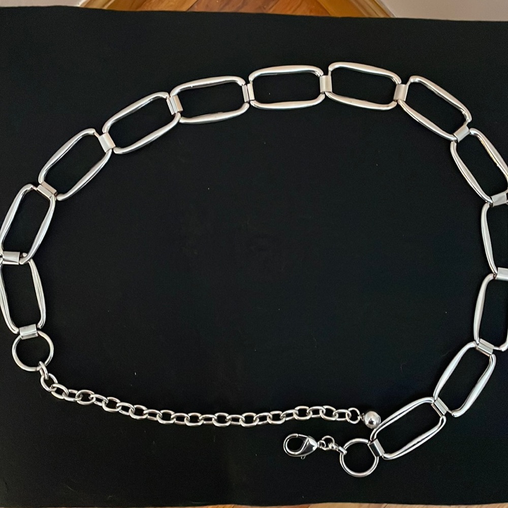 Silver tone women’s belt. 36 inches in total length.